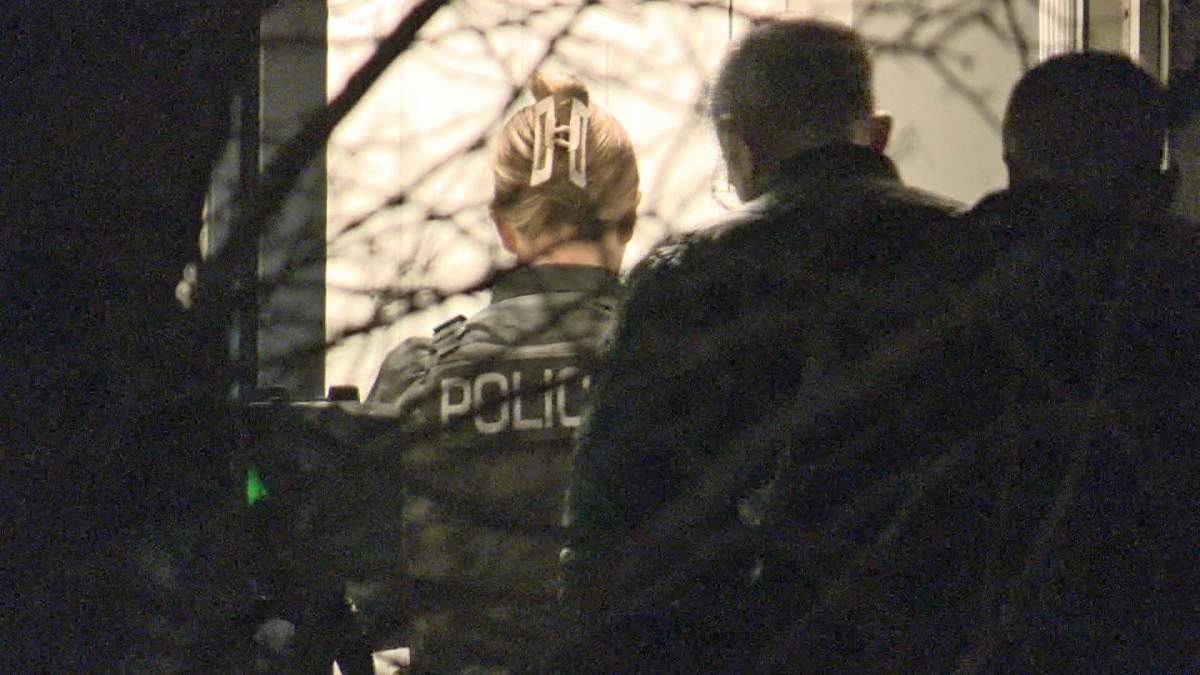 When officers arrived at the house on Redstone Park, they discovered two people with severe injuries who later died.