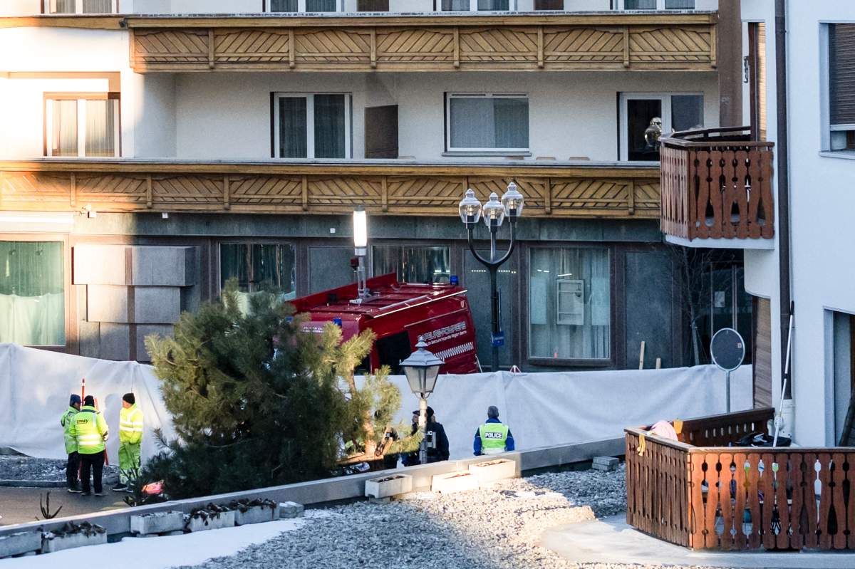 Police officers inspect the area where a fire broke out at the Le Constellation bar and lounge leaving people dead and injured, during New Year’s celebration, in Crans-Montana, Swiss Alps, Switzerland, Thursday, Jan. 1, 2026.