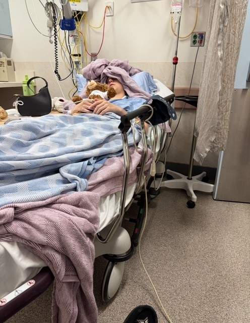 Talia Assu-Gregg, 20, in the hospital because of an endometriosis flare-up.