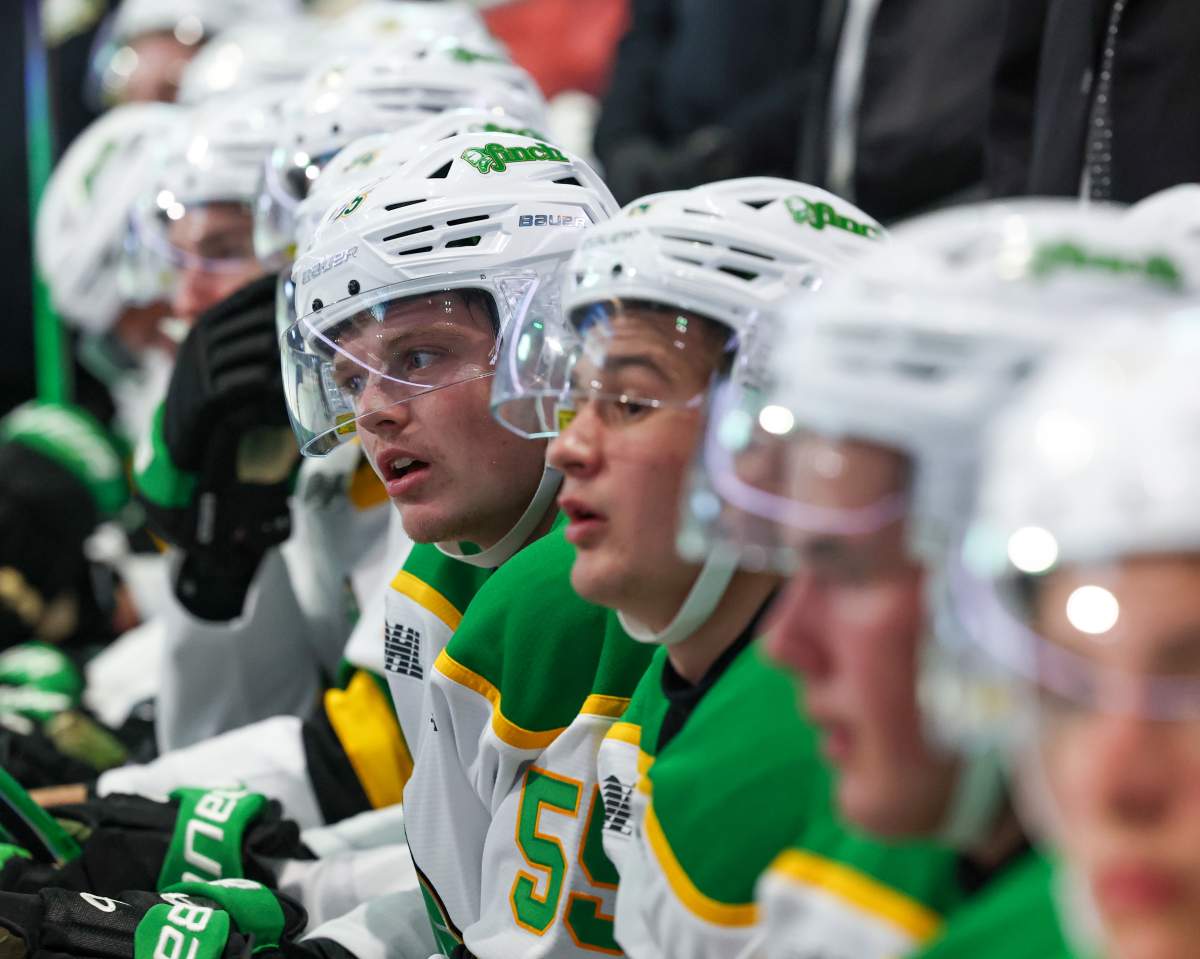 London Knights players on the bench.