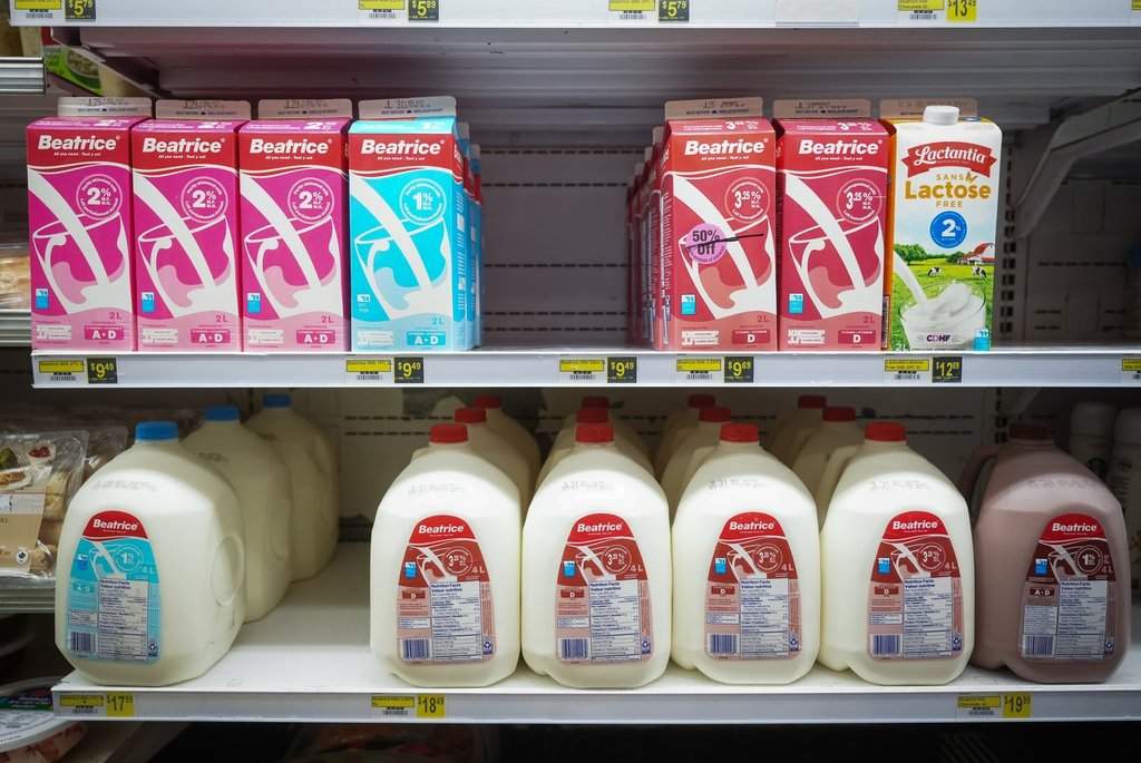 Jugs and cartons of milk are displayed for sale on shelves at NorthMart, in Inuvik, N.W.T., on Thursday, July 24, 2025. THE CANADIAN PRESS/Darryl Dyck.
