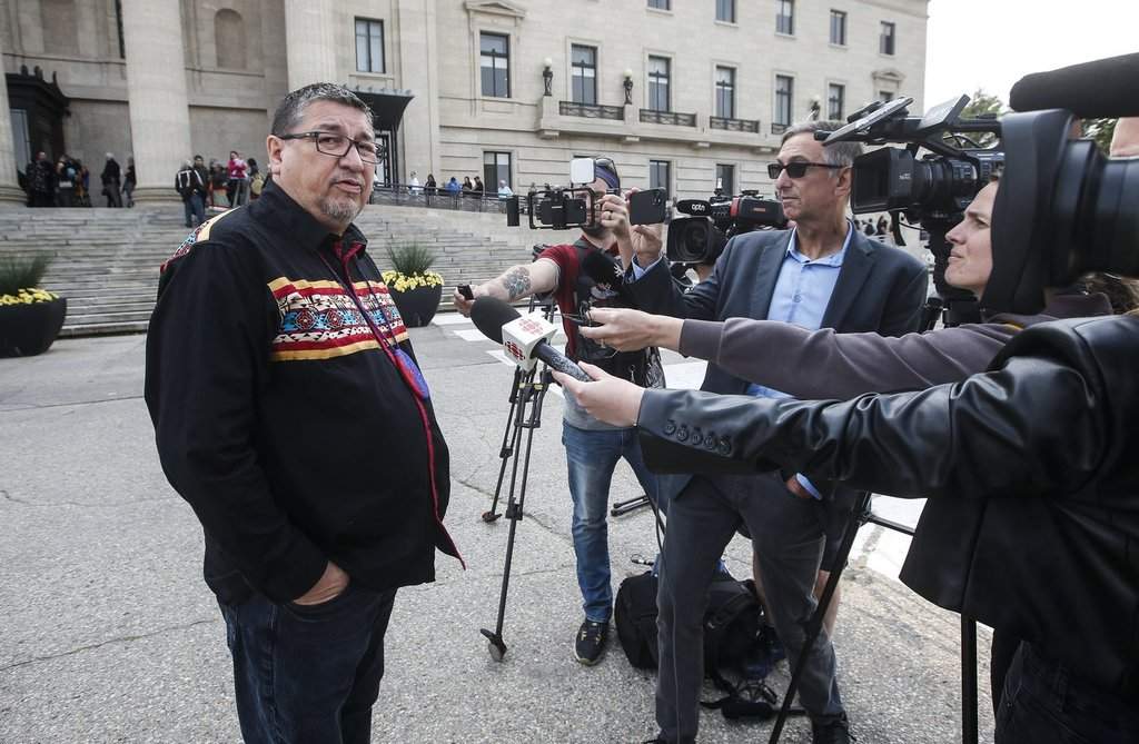 Pimicikamak Cree Nation chief Chief David Monias speaks to media as people lineup to sign a memorial book and to view the body of Grand Chief Cathy Merrick who was lying in state at the Legislature in Winnipeg on Wednesday, Sept. 11, 2024. THE CANADIAN PRESS/John Woods.