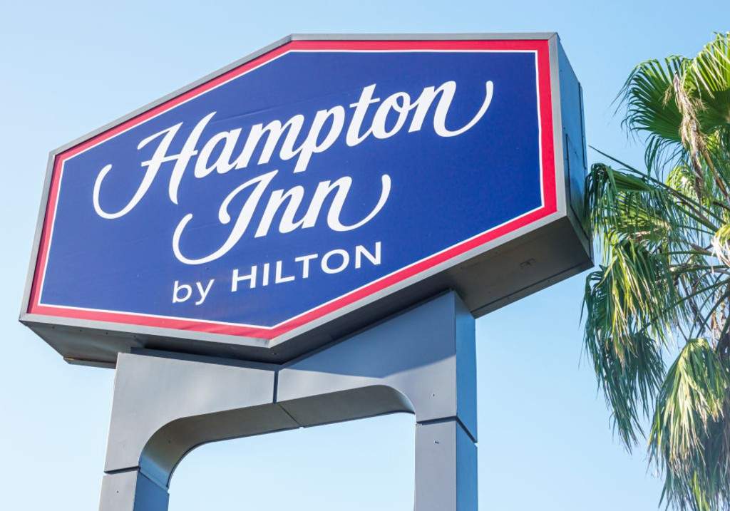A file photo of a Hampton Inn by Hilton hotel sign.