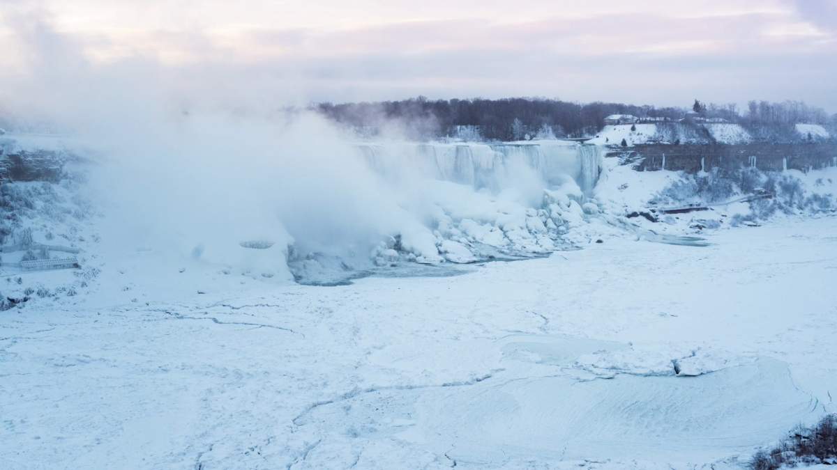 Mist and frozen surface water has created the appearance Niagara Falls is in a deep freeze.
