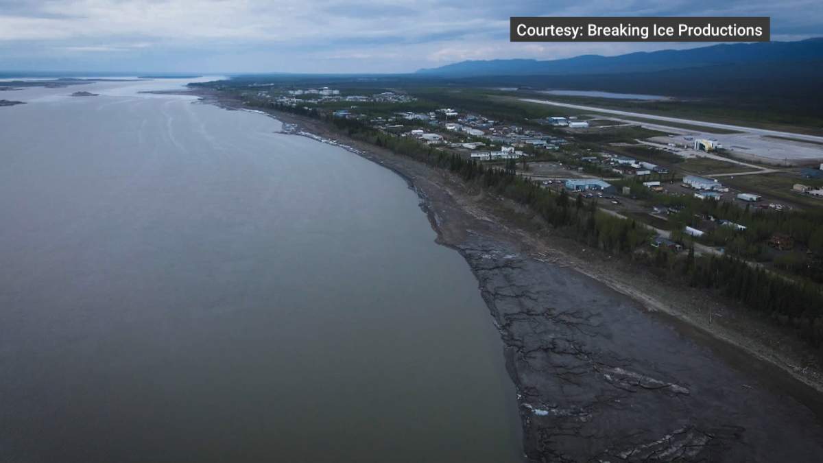 Norman Wells is located almost 700 kilometres northwest of Yellowknife on the west bank of the Mackenzie River, in the shadow of the MacKenzie Mountains and has a population of about 800.