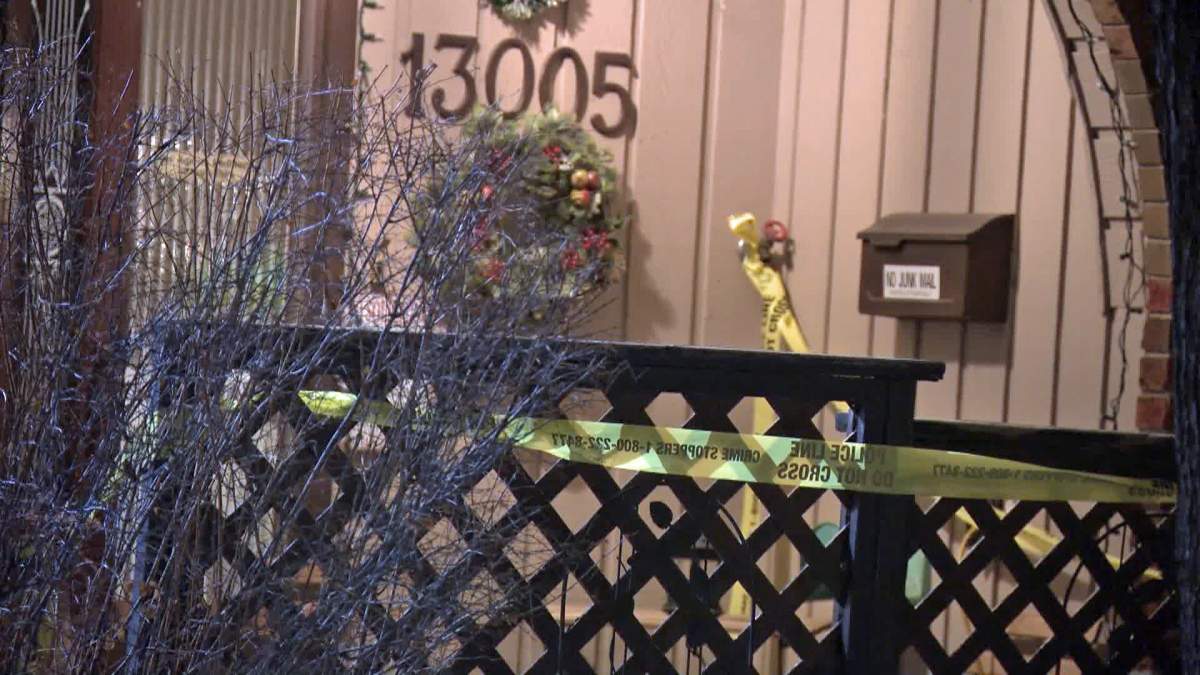 Police tape surrounds a home on Canterbury Gardens southwest after Calgary police were called out on Thursday to investigate the suspicious death of a woman in her 80s.