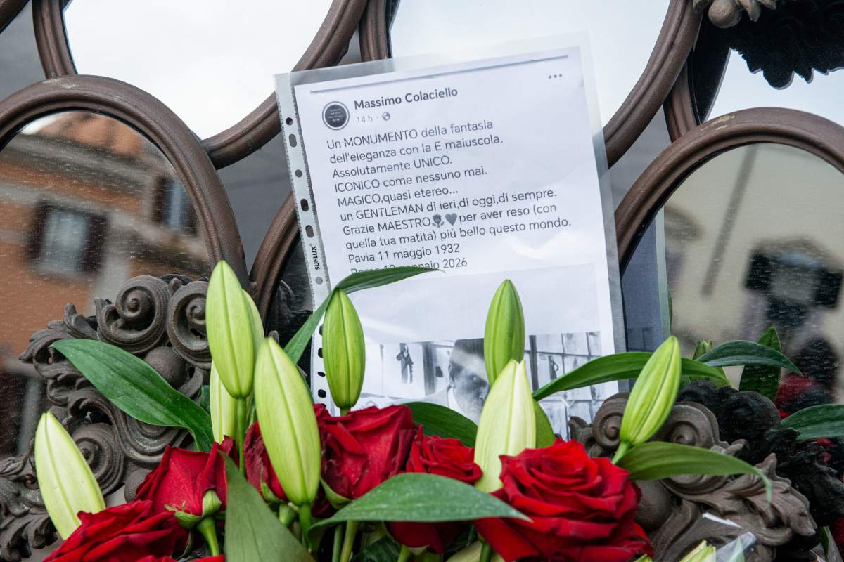 Flowers are laid with messages from supporters following Valentino Garavani's death.