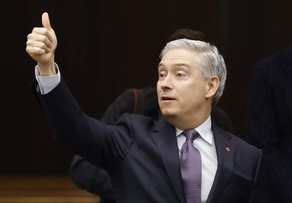 Finance and National Revenue Minister Francois-Philippe Champagne greets committee members before his appearance at the House of Commons Standing Committee on Finance in Ottawa, Thursday, Feb. 5, 2026. THE CANADIAN PRESS/ Patrick Doyle.