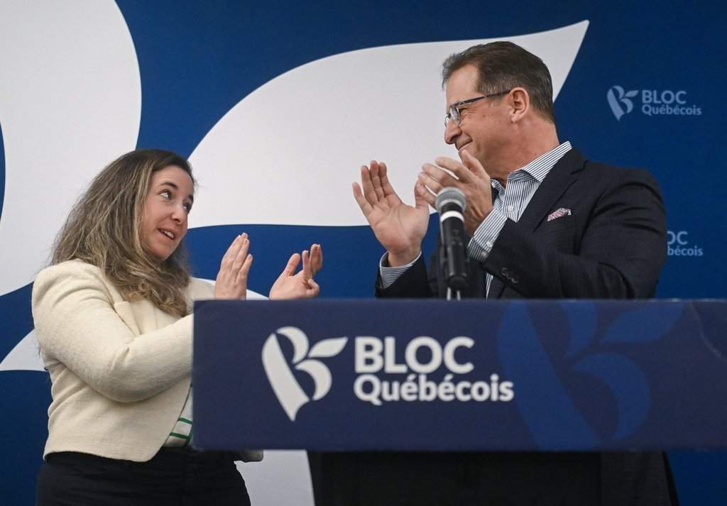 Bloc Quebecois leader Yves-François Blanchet, right, applauds Terrebonne federal byelection candidate Nathalie Sinclair-Desgagne during a news conference in Terrebonne, Que., Thursday, Feb. 26, 2026.