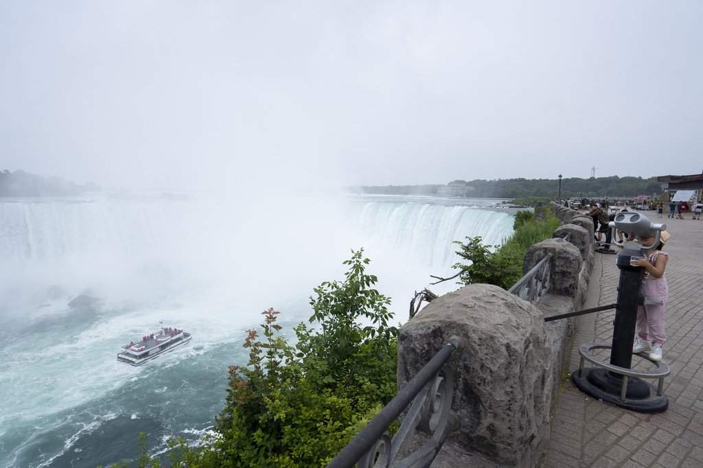A Niagara tour boat to the falls approaches the Horseshoe Falls in Niagara Falls, Ont. on July 16, 2021. THE CANADIAN PRESS/Peter Power.