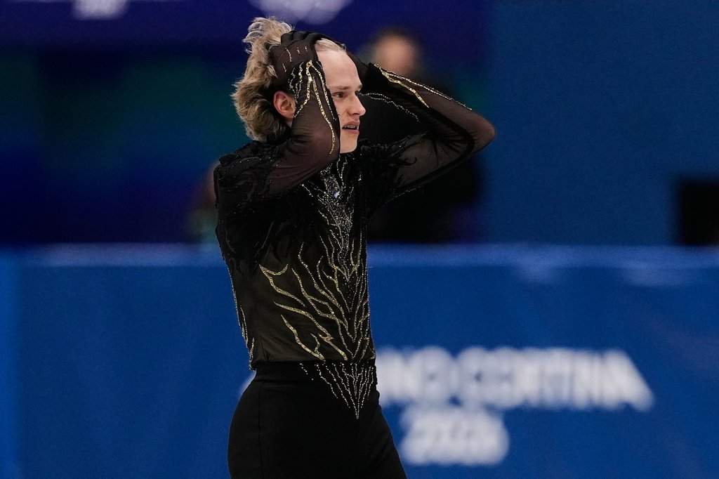 Ilia Malinin of the United States competes during the men's free skate program in figure skating at the 2026 Winter Olympics, in Milan, Italy, Friday, Feb. 13, 2026. (AP Photo/Ashley Landis).