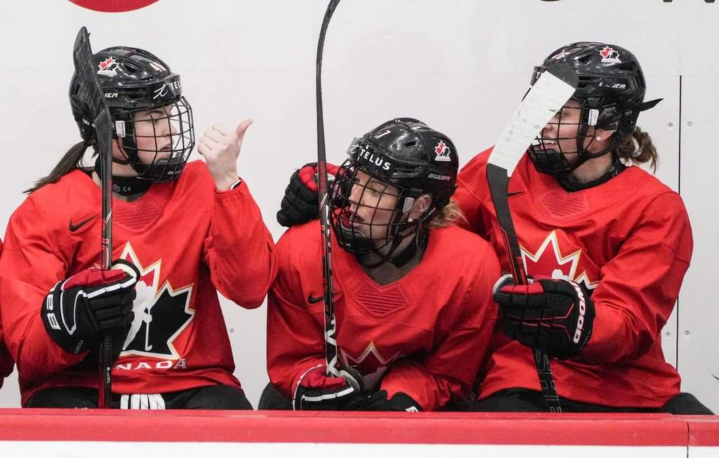 Canada's Blayre Turnbull (40) speaks with teammates Laura Stacey (7) and Emily Clark (26) during practice at the IIHF Women's World Hockey Championship in Utica, N.Y., Wednesday, April 10, 2024. THE CANADIAN PRESS/Christinne Muschi.