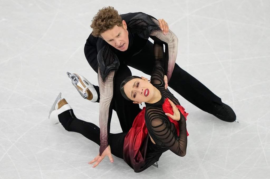 Madison Chock and Evan Bates of the United States compete during the ice dancing free skate in figure skating at the 2026 Winter Olympics, in Milan, Italy, Wednesday, Feb. 11, 2026.