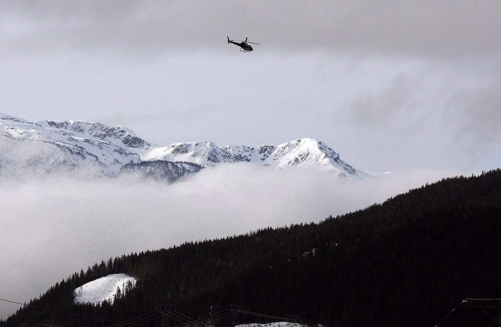 A Search and Rescue helicopter flies near Revelstoke, B.C., on March 14, 2010. 