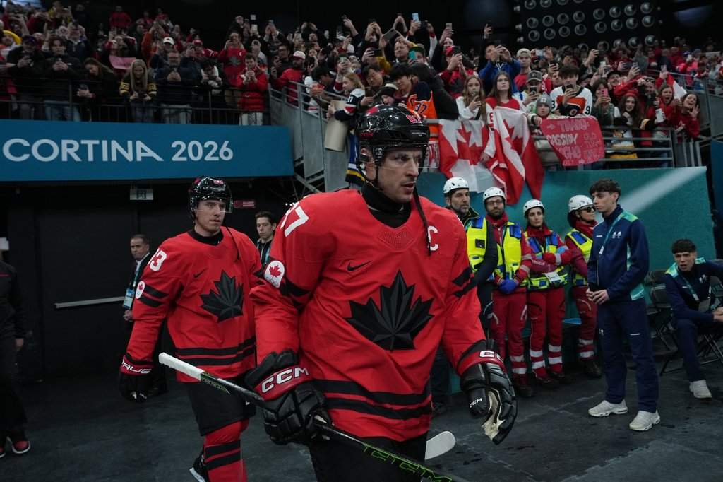 Canada's Sidney Crosby (87) and Mitch Marner (93) walk to the warmup ahead of a quarter-final men's hockey game against Czechia at the 2026 Winter Olympics, in Milan, on Wednesday, Feb. 18, 2026.