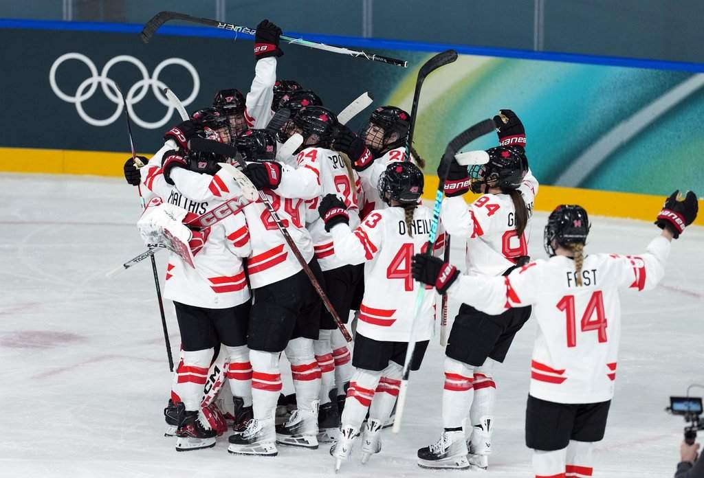 Canada celebrates their win over Switzerland during the preliminary round of the women's hockey game at the Milan Cortina Winter Olympics, in Milan, on Saturday, Feb. 7, 2026. THE CANADIAN PRESS/Darryl Dyck.