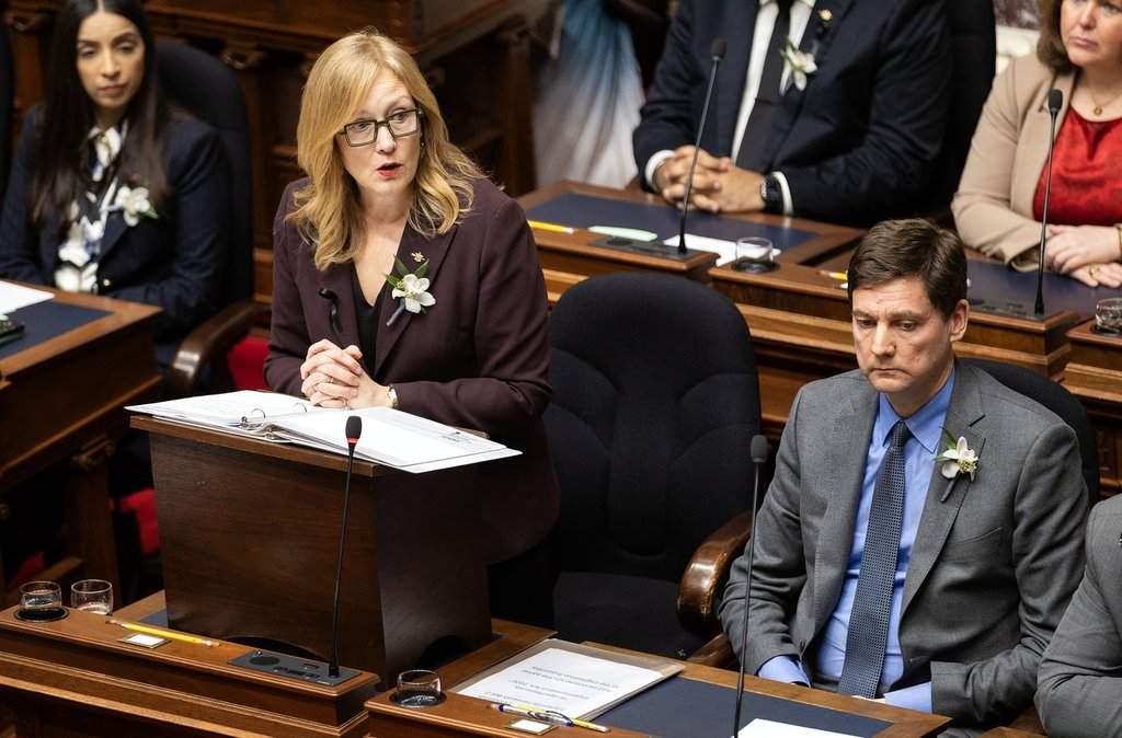 B.C. Minister of Finance Brenda Bailey tables the provincial budget as Premier David Eby, right, looks on in the assembly at legislature in Victoria, on Tuesday, Feb. 17, 2026. 