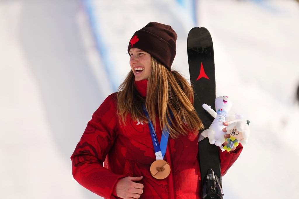 Megan Oldham, of Canada, reacts after winning the bronze medal in the women's freeski slopestyle final at the Milano Cortina 2026 Winter Olympic Games in Livigno, Italy on Monday, Feb. 9, 2026. THE CANADIAN PRESS/Sean Kilpatrick.