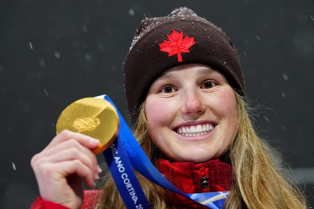 Canada's Megan Oldham shows off her gold medal following the women's free ski big air final at the Milano Cortina 2026 Winter Olympic Games in Livigno, Italy, Monday, Feb. 16, 2026. THE CANADIAN PRESS/Sean Kilpatrick.