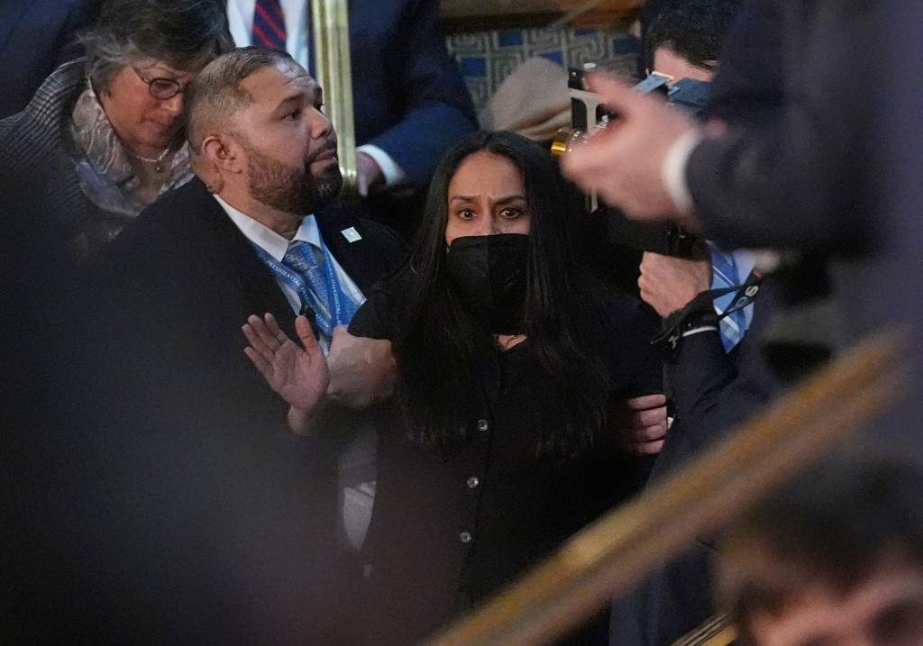 Aliya Rahman is removed from the House chamber as President Donald Trump delivers the State of the Union address to a joint session of Congress at the U.S. Capitol in Washington, Tuesday, Feb. 24, 2026.