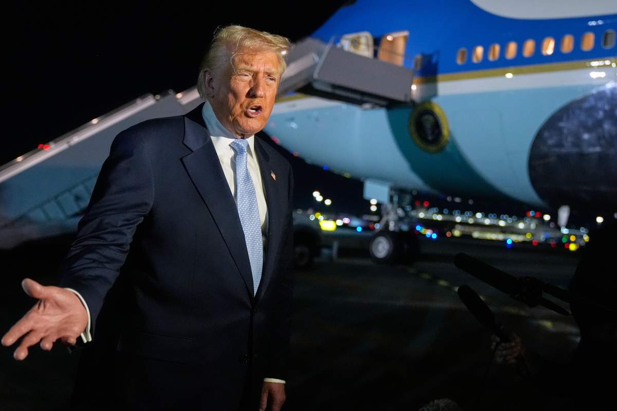 U.S. President Donald Trump speaks to reporters before boarding Air Force One at Palm Beach International Airport in West Palm Beach Fla., on his way back to the White House, Sunday, Nov. 16, 2025.