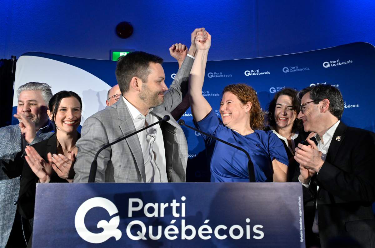 Parti Québécois candidate Marie-Karlynn Laflamme, left, and Parti Québécois Leader Paul St-Pierre Plamondon celebrate her victory in the byelection in the riding of Chicoutimi in Saguenay, Que., Monday, Feb. 23, 2026. 