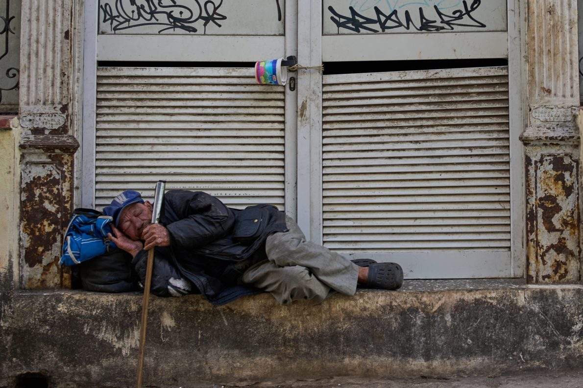 A man sleeps on a street in Havana, Tuesday, Feb. 24, 2026. (AP Photo/Ramon Espinosa).