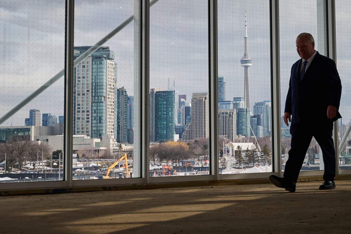 Ontario Premier Doug Ford arrives to speak to media at the construction site of the future science centre at Ontario Place in Toronto, on Thursday, Feb. 26, 2026.