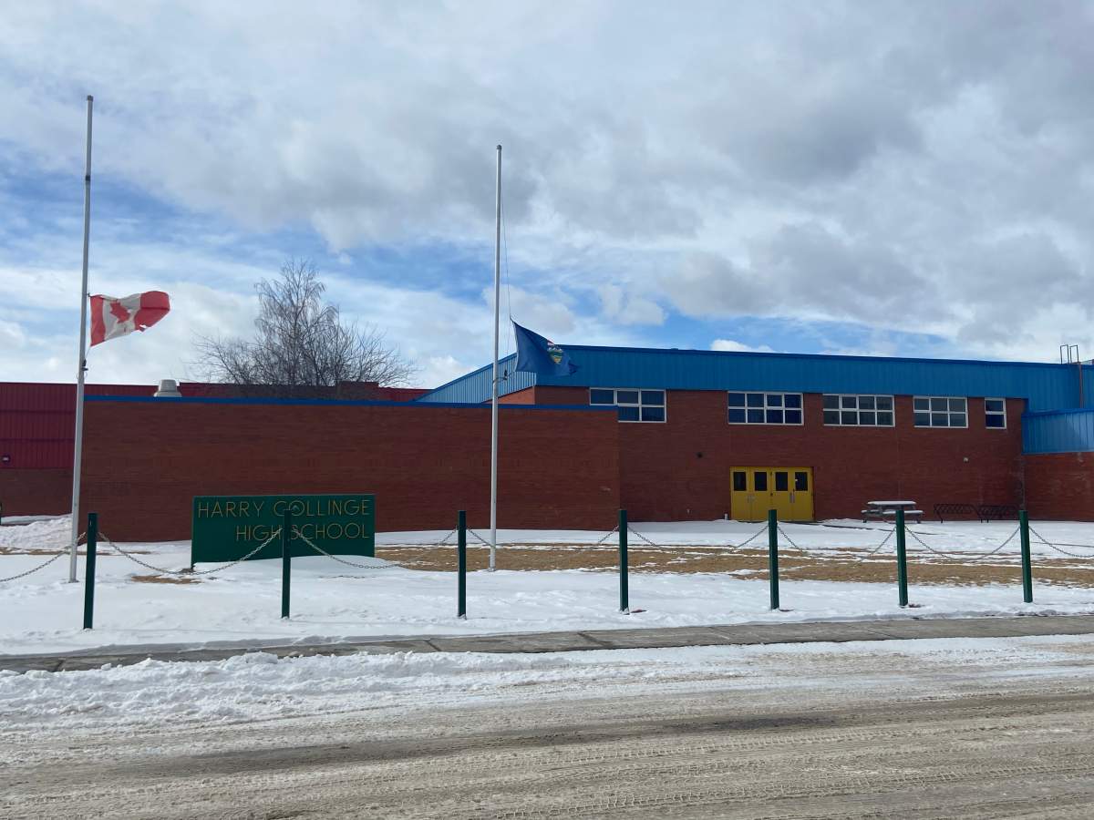 Flags at half mast at Harry Collinge High School in Hinton, where classes were cancelled after two students died in a collision near Jasper on Monday, Feb. 23, 2026.