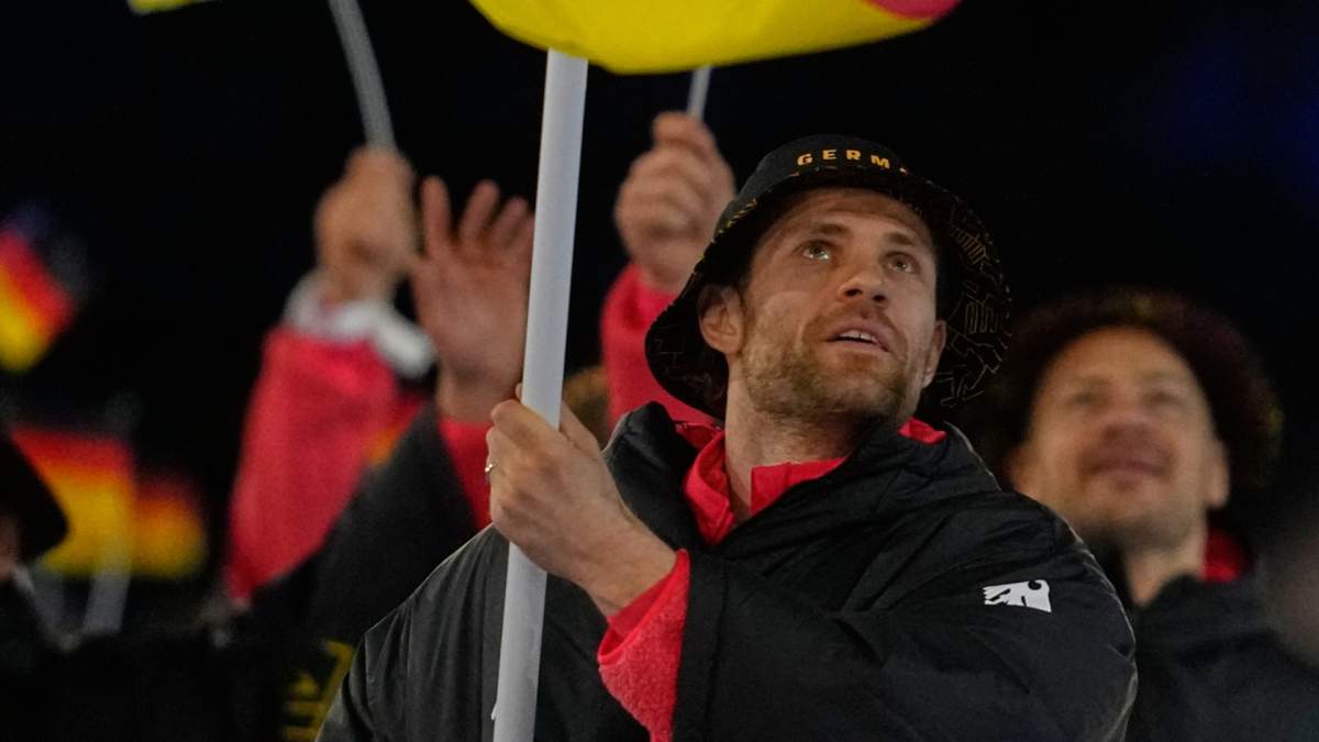 Leon Draisaitl, flag bearer of Germany arrives during the Olympic opening ceremony at the 2026 Winter Olympics, in Milan, Italy, Friday, Feb. 6, 2026.