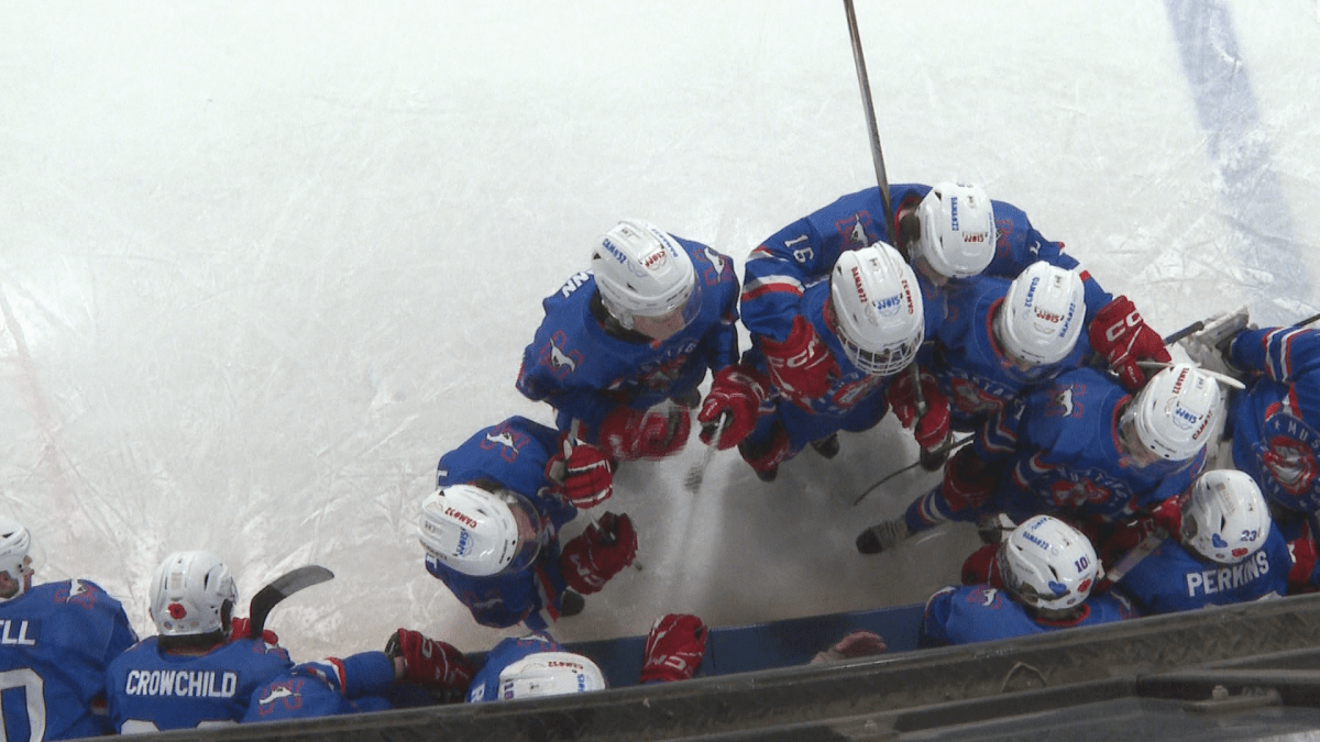 The Southern Alberta Mustangs huddled together on the ice.