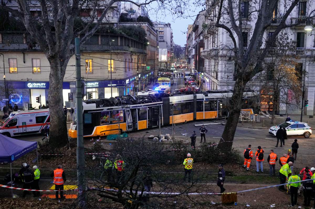 Emergency cervices work at the scene of a derailment on Line 9 in Milan, Italy, Friday, Feb. 27, 2026.