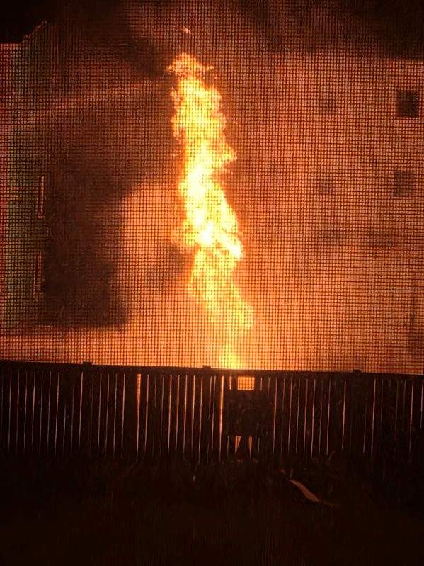 Fire flares from a propane tank in northeast Edmonton on Feb. 21, 2026.