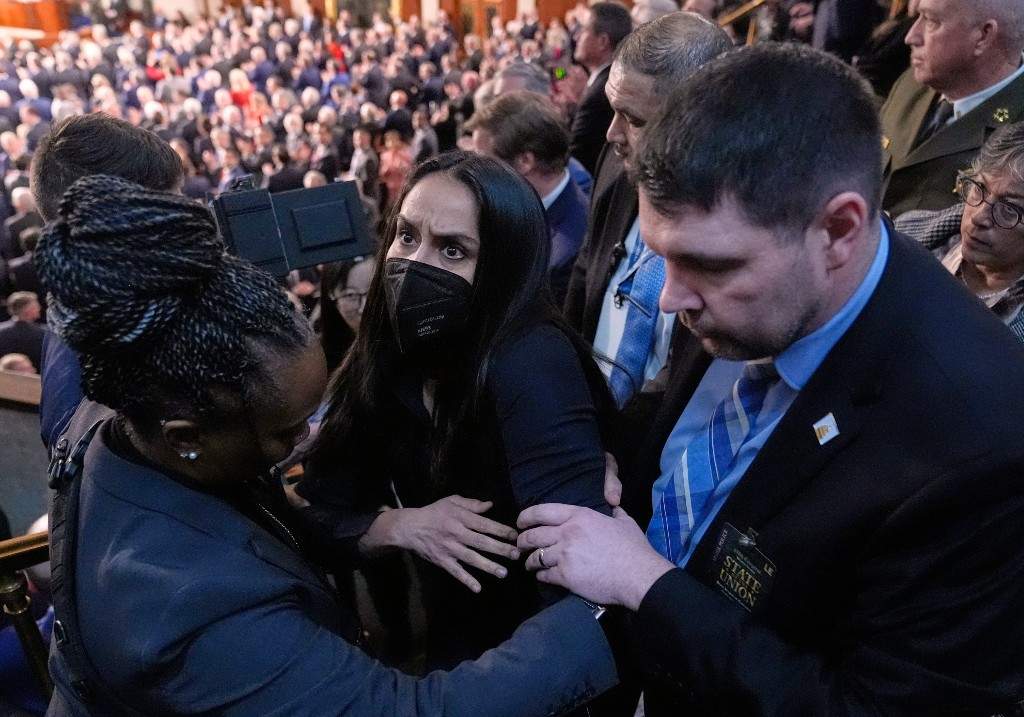 Aliya Rahman is removed from the House chamber as President Donald Trump delivers the State of the Union address to a joint session of Congress at the U.S. Capitol in Washington, Tuesday, Feb. 24, 2026.
