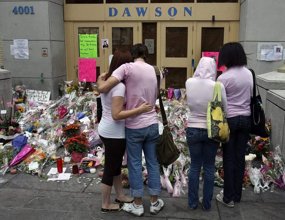 Students wear pink in honour of Anastasia De Sousa before they re-enter Dawson College in Montreal Monday, Sept. 18, 2006. 