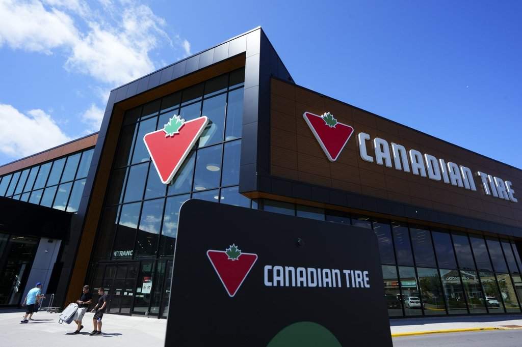 Shoppers come and go from a Canadian Tire store in Ottawa on Friday, Aug. 11, 2023. T.