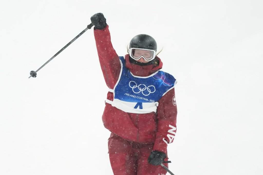 Canada's Megan Oldham pumps her fist as she comes into the finish zone following her first run in the women's free ski big air at the Milan Cortina 2026 Winter Olympic Games in Livigno, Italy on Monday, Feb. 16, 2026. THE CANADIAN PRESS/Sean Kilpatrick.