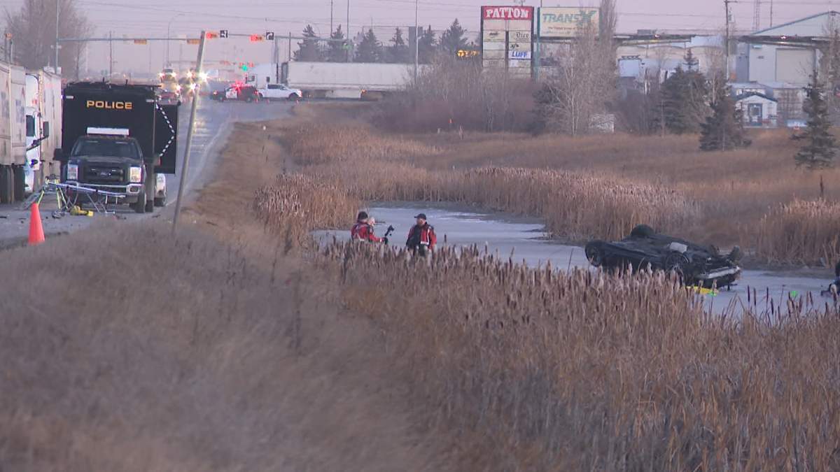 A vehicle could be seen lying upside down in the ditch, along 84 St. SE, in Calgary, following a fatal crash early Wednesday morning.