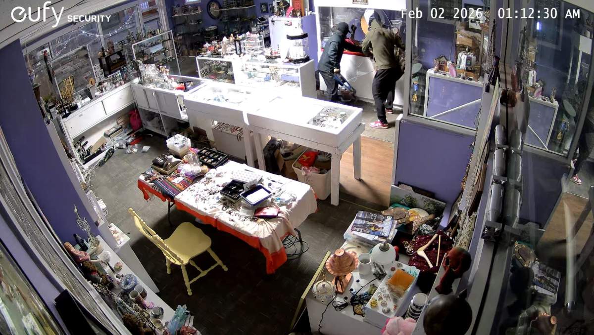 This CCTV image shows the thieves putting to stolen gold into a backpack or duffel bag, before fleeing the jewelery store.