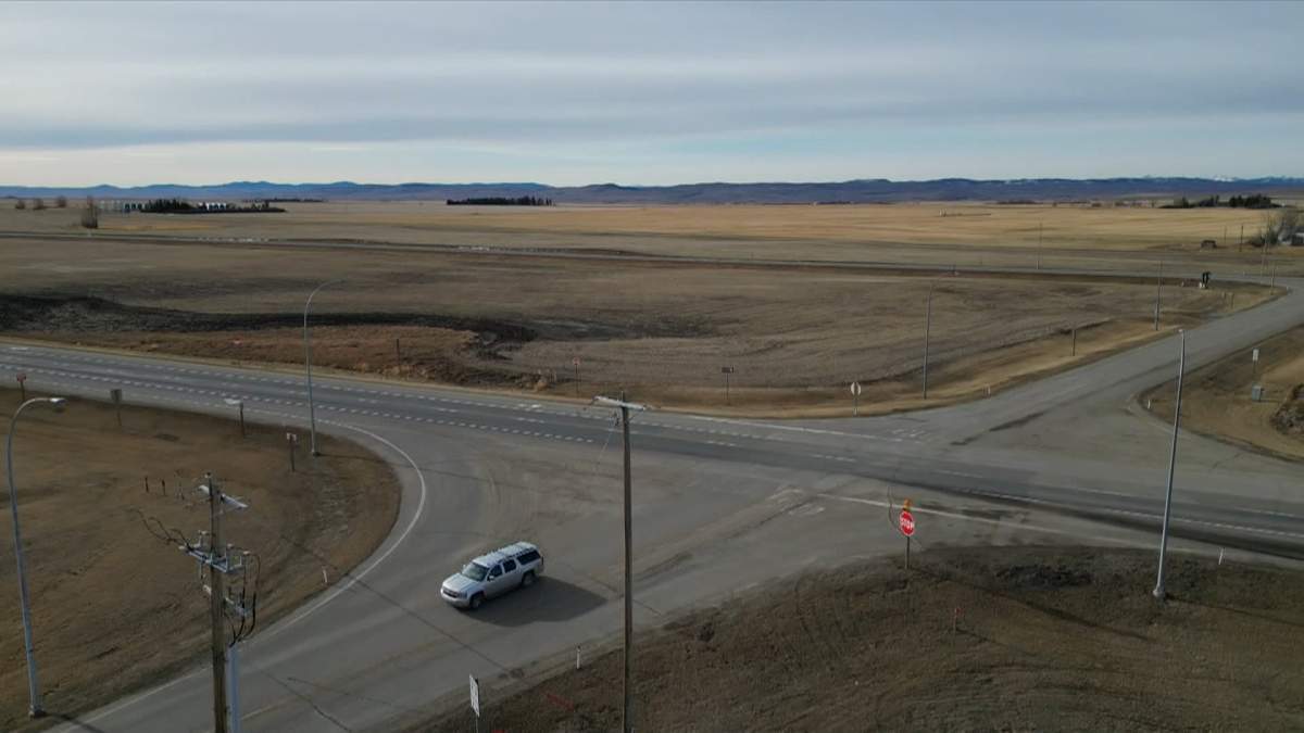 A drone view of the intersection of Highway 2 and 55 Avenue in Stavely, Alta, where three junior hockey players were killed in a crash with a semi-truck on Monday.