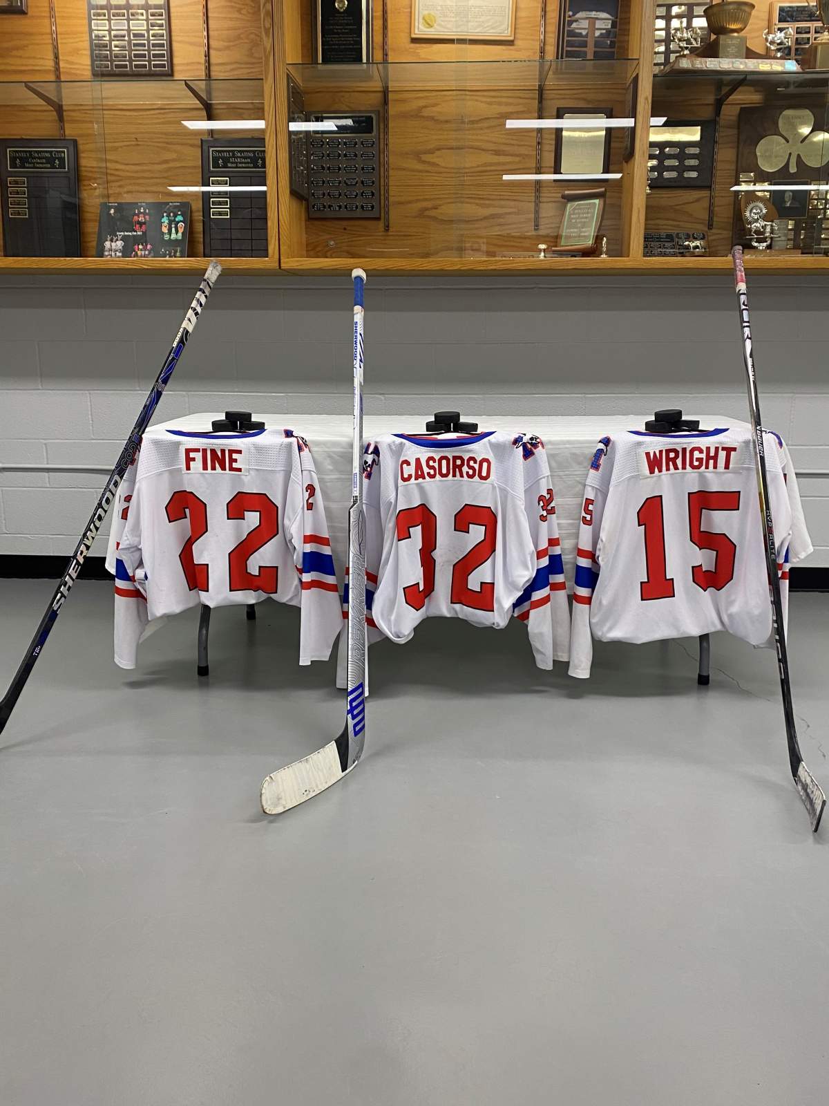 A memorial, with the jerseys of the three hockey players who died in the crash, has been set up at the Stavely arena.