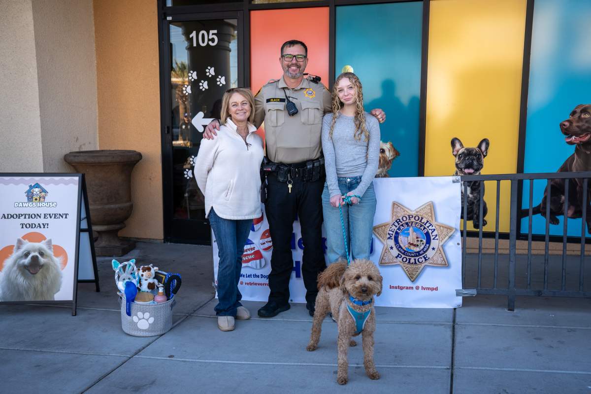 Skeeter Black and his family pose with Jet Blue after officially adopting him.