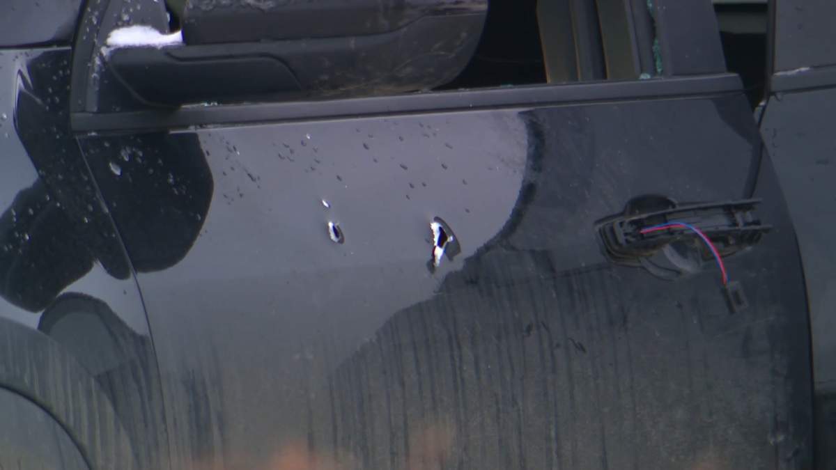 What appears to be bullet holes could be seen in the side of a vehicle at the scene of a fatal shooting in Edmonton on Monday.