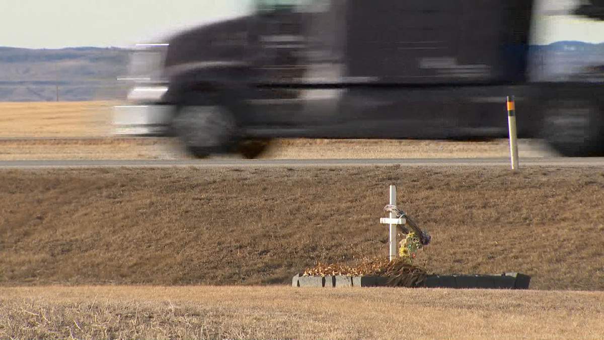 What appears to be a memorial to a victim of another crash along the same stretch of highway is seen, just a few steps away from where Monday's fatal crash happened.