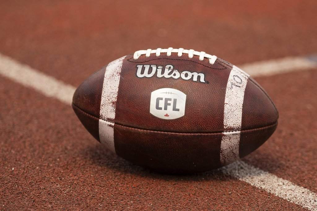 Canadian Football League logo seen on a football during CFL training camp at Alumni Stadium in Guelph, Ont., Sunday, May 12, 2024. THE CANADIAN PRESS/Nick Iwanyshyn.