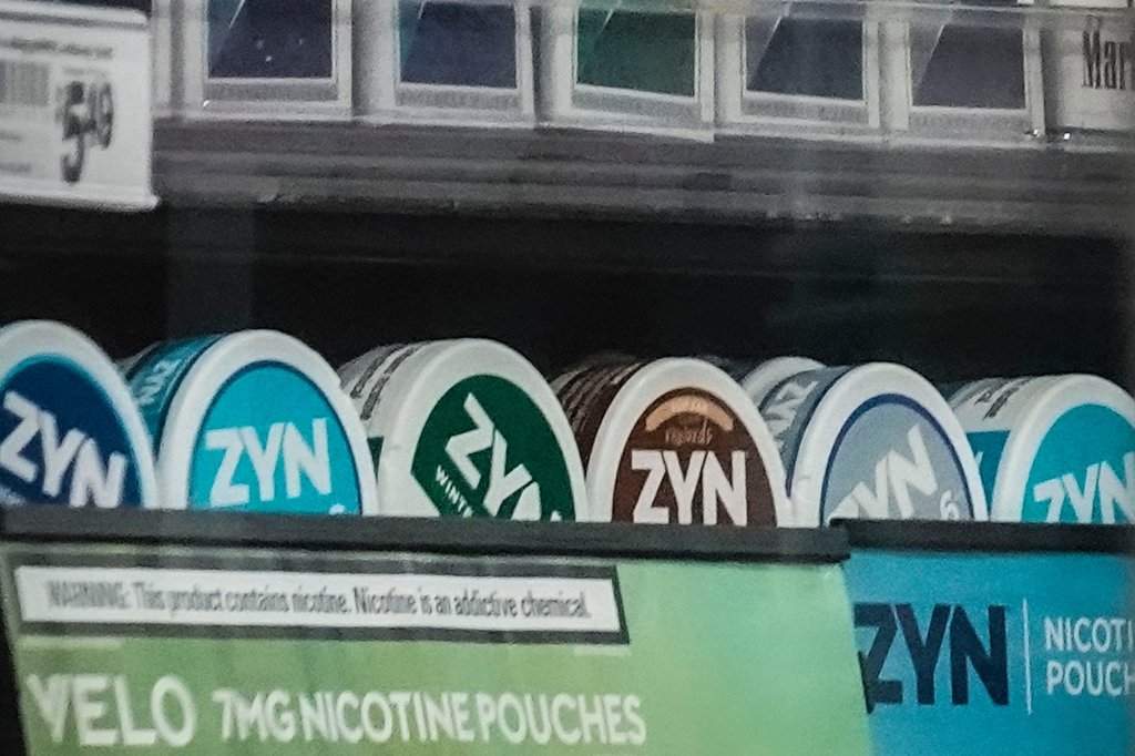 Containers of Zyn, a smokeless nicotine pouch, are displayed for sale among other nicotine and tobacco products at a newsstand on Feb. 23, 2024, in New York.