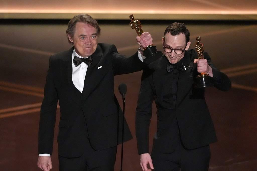 Maciek Szczerbowski, left, and Chris Lavis accept the award for animated short film for “The Girl Who Cried Pearls” during the Oscars on Sunday, March 15, 2026, at the Dolby Theatre in Los Angeles.