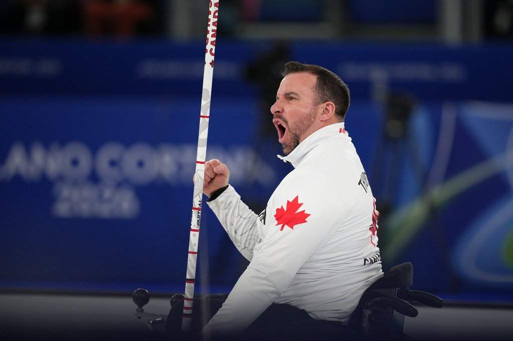 Jon Thurston, of Canada, reacts during the wheelchair curling mixed team gold medal game versus China at the 2026 Winter Paralympics, in Cortina d'Ampezzo, Italy, Saturday, March 14, 2026. (AP Photo/Emilio Morenatti).