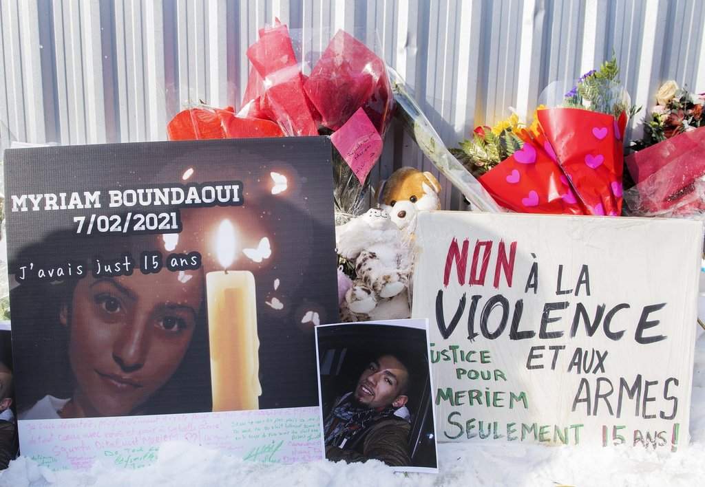 A makeshift memorial is shown during a vigil and protest against gun violence in memory of Meriem Boundaoui in Montreal, Sunday, Feb. 14, 2021. 