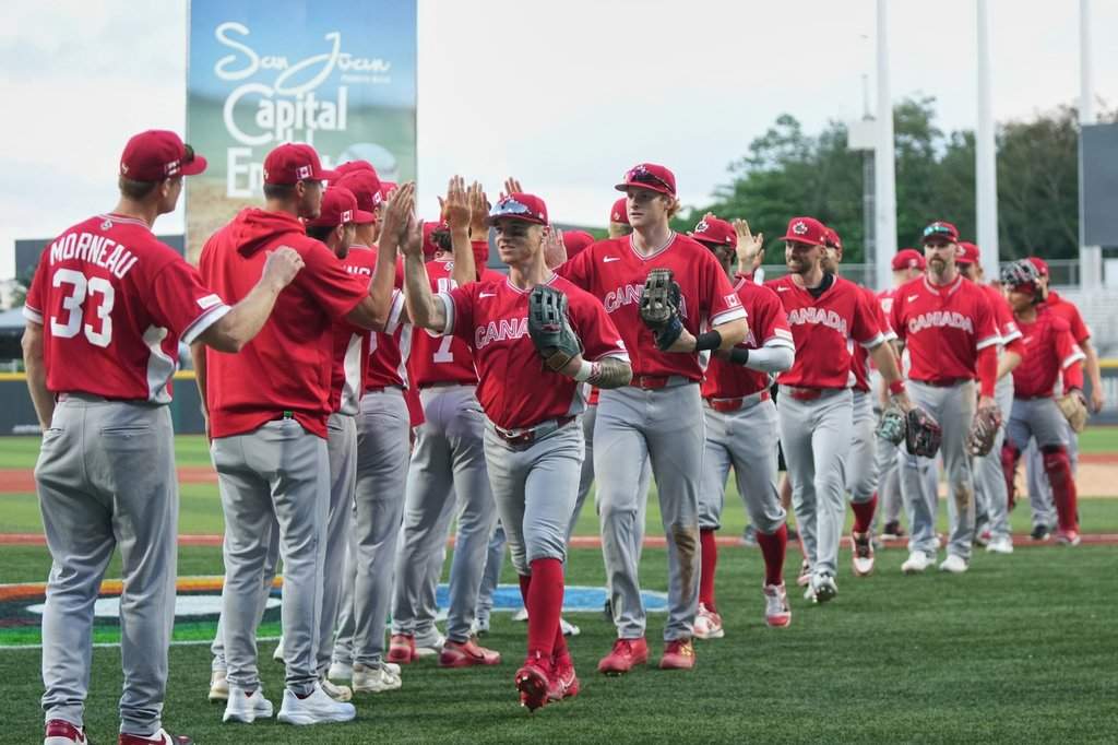 Canada's players celebrate at the end of a World Baseball Classic game against Cuba in San Juan, Puerto Rico, Wednesday, March 11, 2026. 